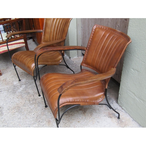 2074 - Pair of Designer Tan Leather Armchairs Wrought Iron Frames Wooden Panel Armrests Good Construction