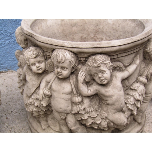 2091 - Composite Stone Pair of Circular Planters with Cherub Motif Decoration Each Approximately 12 Inches ... 