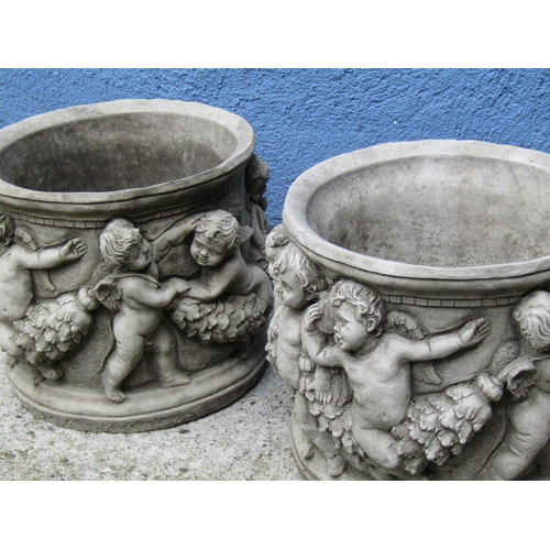 2091 - Composite Stone Pair of Circular Planters with Cherub Motif Decoration Each Approximately 12 Inches ... 