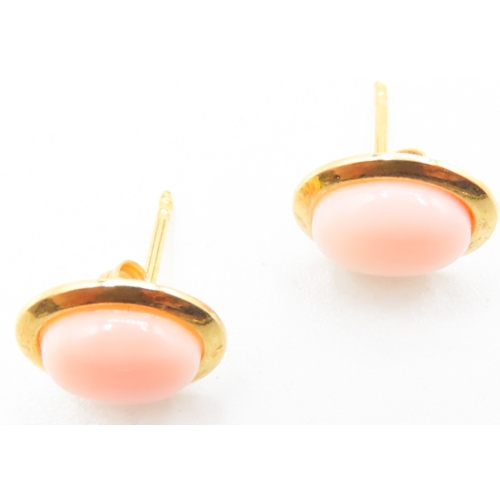 102 - Pair of Coral Set Oval Form Earrings Mounted in 18 Carat Yellow Gold 1cm High