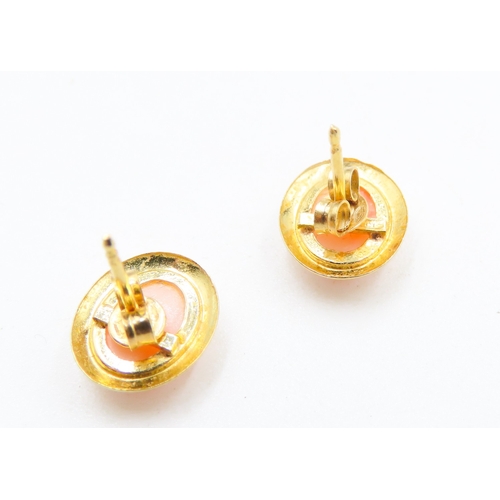 102 - Pair of Coral Set Oval Form Earrings Mounted in 18 Carat Yellow Gold 1cm High