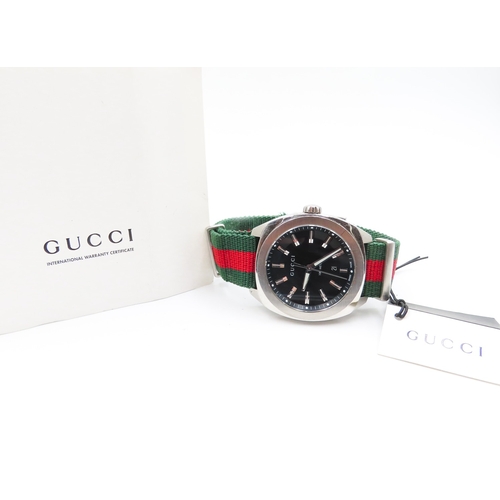 109 - Gucci G-Frame Stainless Steel Swiss Made Wristwatch Canvas Strap Date Aperture Black Dial Glow in Da... 