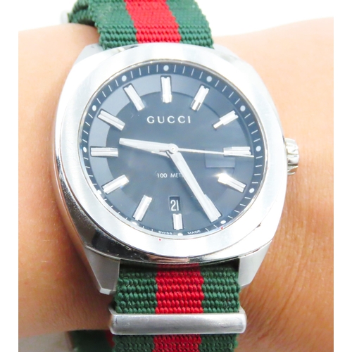 109 - Gucci G-Frame Stainless Steel Swiss Made Wristwatch Canvas Strap Date Aperture Black Dial Glow in Da... 