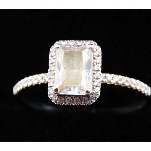 113 - Emerald Cut Gemstone Set Halo Surround Ring with Further Gemstones set to Shoulders Mounted in 10 Ca... 