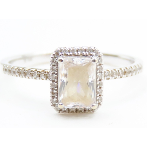 113 - Emerald Cut Gemstone Set Halo Surround Ring with Further Gemstones set to Shoulders Mounted in 10 Ca... 