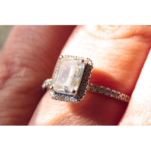 113 - Emerald Cut Gemstone Set Halo Surround Ring with Further Gemstones set to Shoulders Mounted in 10 Ca... 