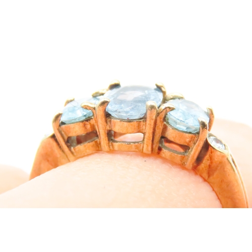 117 - Three Stone Blue Topaz Ring further Diamonds Set to Shoulders Mounted in 9 Carat Yellow Gold Ring Si... 