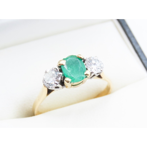 121 - Emerald and Diamond Set Three Stone Ring Four Claw Set Mounted in 18 Carat Yellow Gold Ring Size Q