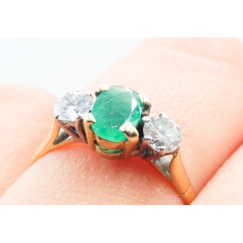 121 - Emerald and Diamond Set Three Stone Ring Four Claw Set Mounted in 18 Carat Yellow Gold Ring Size Q