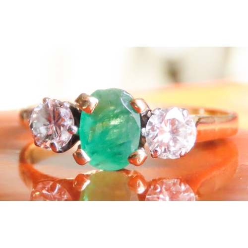 121 - Emerald and Diamond Set Three Stone Ring Four Claw Set Mounted in 18 Carat Yellow Gold Ring Size Q