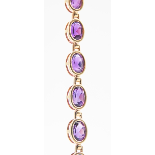 147 - Amethyst Bezel Set Nineteen Stone Bracelet Mounted in 9 Carat Yellow Gold 18.5cm Long