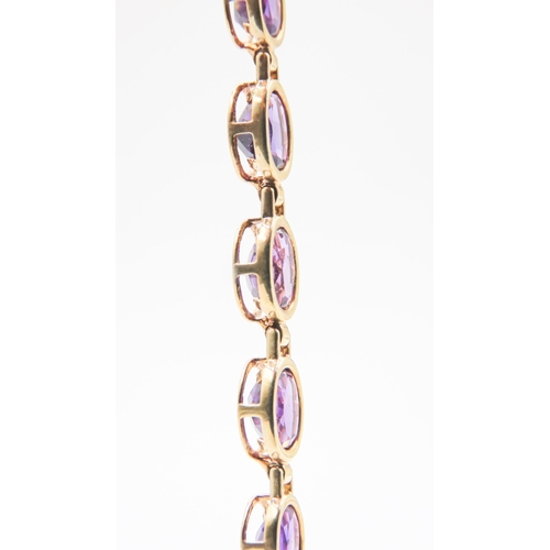 147 - Amethyst Bezel Set Nineteen Stone Bracelet Mounted in 9 Carat Yellow Gold 18.5cm Long