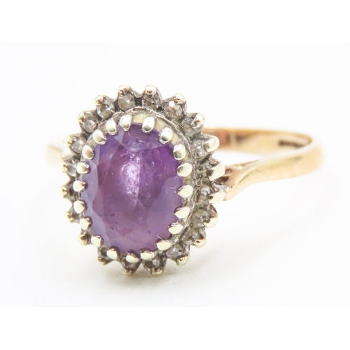 152 - Oval Cut Amethyst Centre Stone Ring with Diamond Halo Surround Mounted in 9 Carat Yellow Gold Ring S... 