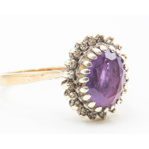 152 - Oval Cut Amethyst Centre Stone Ring with Diamond Halo Surround Mounted in 9 Carat Yellow Gold Ring S... 