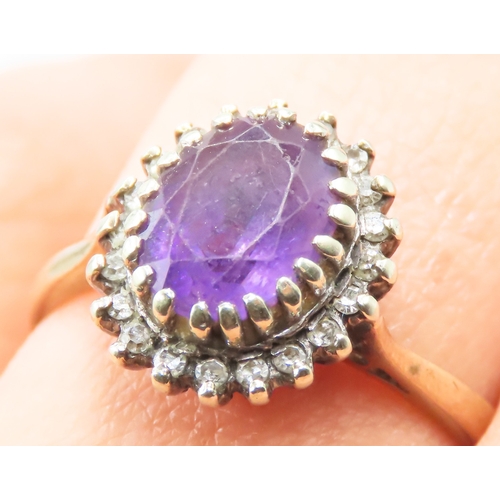 152 - Oval Cut Amethyst Centre Stone Ring with Diamond Halo Surround Mounted in 9 Carat Yellow Gold Ring S... 