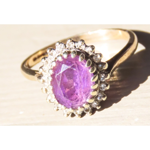 152 - Oval Cut Amethyst Centre Stone Ring with Diamond Halo Surround Mounted in 9 Carat Yellow Gold Ring S... 