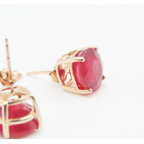 17 - Pair of Ruby Four Claw Basket Set Earrings Mounted on 10 Carat Yellow Gold Rubies 9mm Diameter