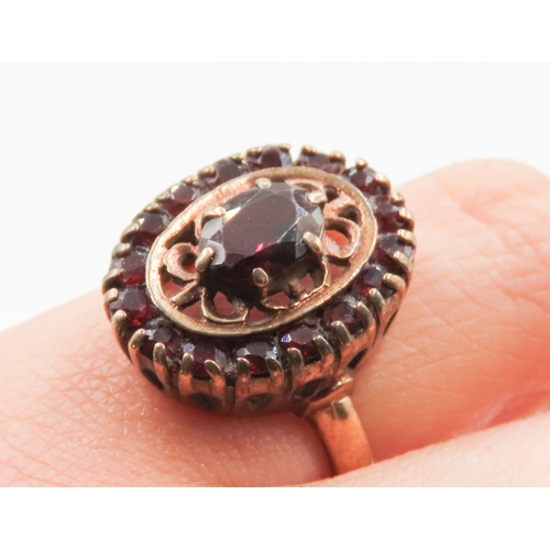 21 - Attractively Detailed Red Garnet Set Filigree Motif Ring Mounted in 9 Carat Yellow Gold Ring Size J