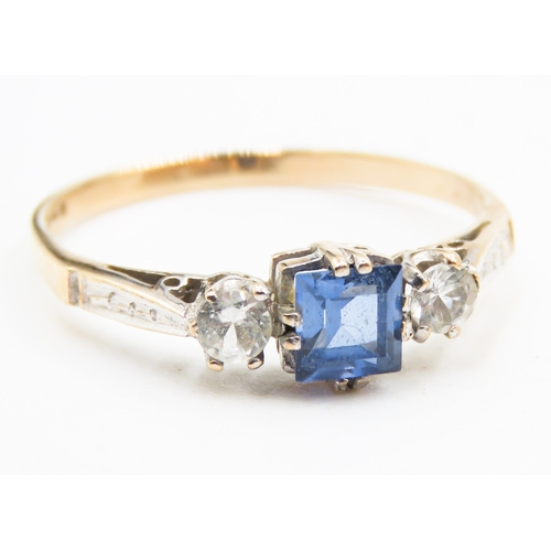 233 - Square Cut Tanzanite and Gemstone Set Three Stone Ring Mounted on 9 Carat Yellow Gold Ring Size T