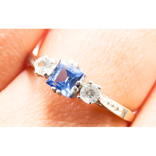 233 - Square Cut Tanzanite and Gemstone Set Three Stone Ring Mounted on 9 Carat Yellow Gold Ring Size T