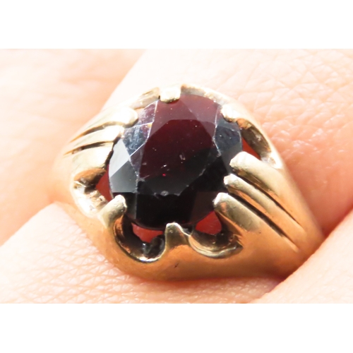 235 - Oval Cut Red Garnet Belcher Set Single Stone Ring Mounted in 9 Carat Yellow Gold Ring Size Q