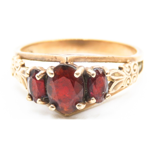 237 - Finely Detailed Red Garnet Three Stone Ring Set in 9 Carat Yellow Gold Ring Size N