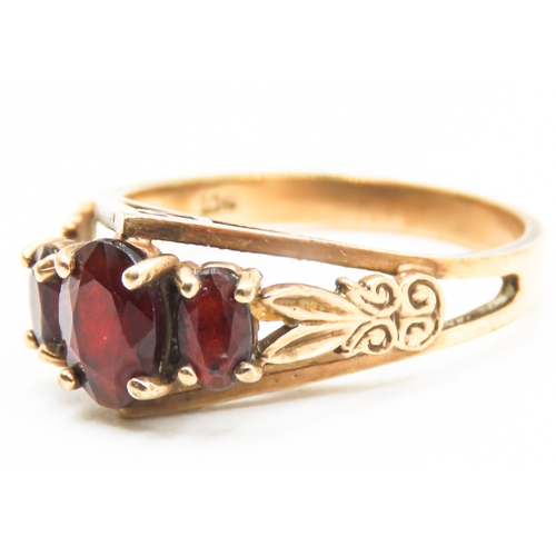 237 - Finely Detailed Red Garnet Three Stone Ring Set in 9 Carat Yellow Gold Ring Size N