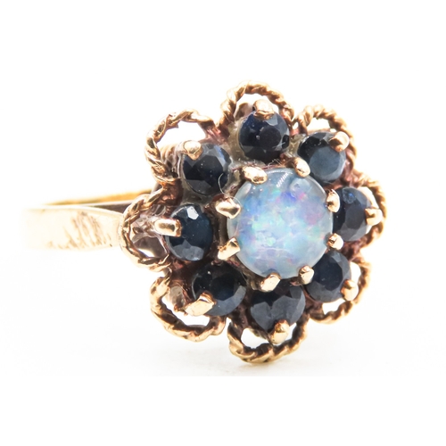 240 - Opal and Sapphire Set Daisy Form Ring Mounted in 9 Carat Yellow Gold Ring Size M and a Half