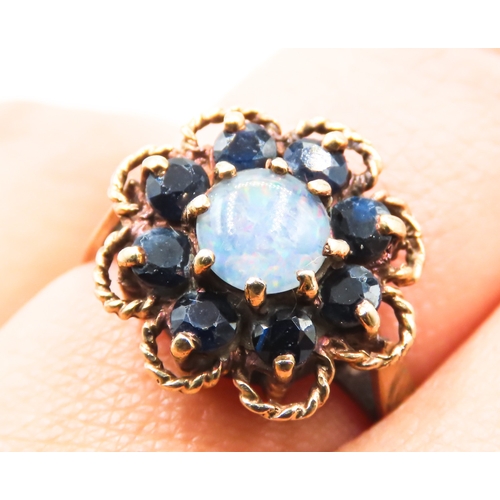 240 - Opal and Sapphire Set Daisy Form Ring Mounted in 9 Carat Yellow Gold Ring Size M and a Half