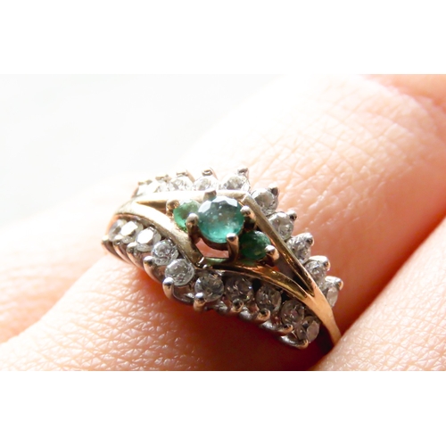 276 - Emerald Three Stone Ring Set with Gemstone Cluster Surround Mounted in 9 Carat Yellow Gold Ring Size... 