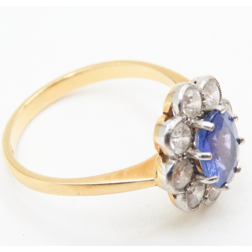 28 - Tanzanite Eight Claw Set Centre Stone Ring with Diamond Halo Set Surround Mounted on 18 Carat Yellow... 