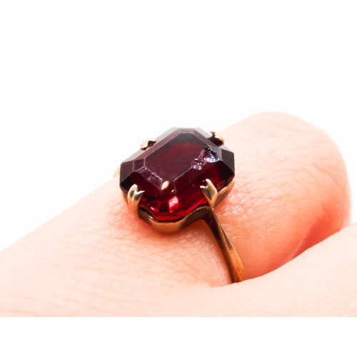 282 - Red Garnet Set Single Stone Ring Mounted in 9 Carat Yellow Gold Ring Size L