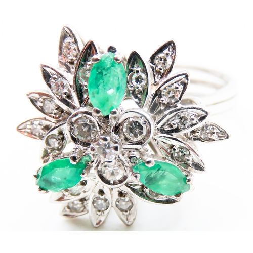 292 - Emerald and Diamond Floral Design Cluster Ring Mounted on 18 Carat White Gold Attractively Detailed ... 