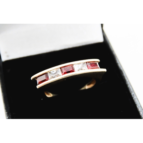 298 - Five Stone Red Garnet and Gemstone Channel Set Ring Mounted in 9 Carat Yellow Gold Ring Size O