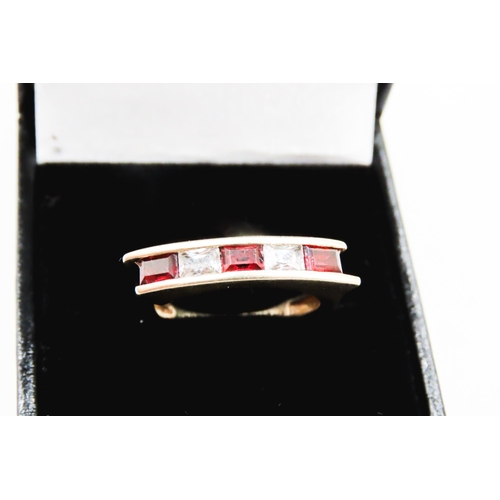 298 - Five Stone Red Garnet and Gemstone Channel Set Ring Mounted in 9 Carat Yellow Gold Ring Size O