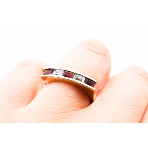 298 - Five Stone Red Garnet and Gemstone Channel Set Ring Mounted in 9 Carat Yellow Gold Ring Size O