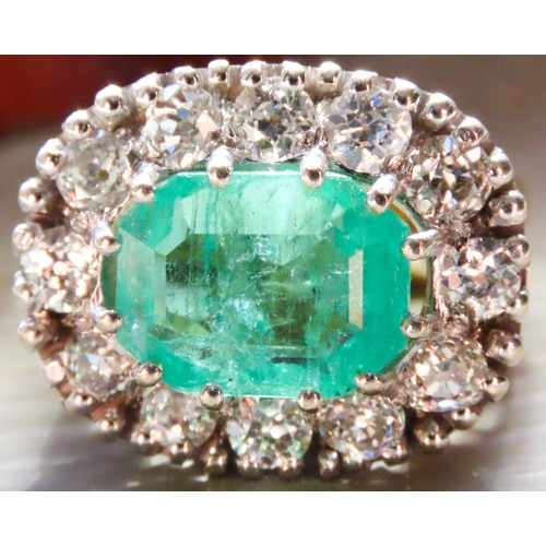 302 - Emerald Centre Stone Ring with Twelve Diamond Set Halo Surround Attractively Detailed Mounted in 18 ... 