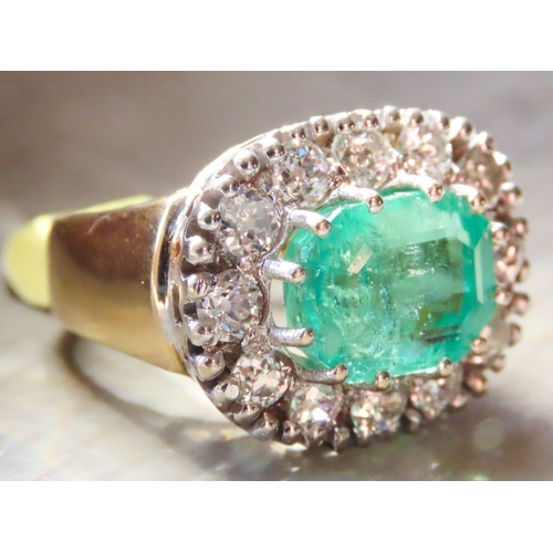 302 - Emerald Centre Stone Ring with Twelve Diamond Set Halo Surround Attractively Detailed Mounted in 18 ... 