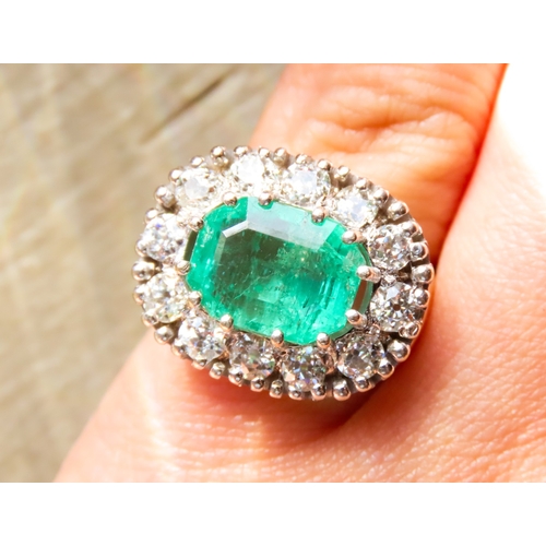 302 - Emerald Centre Stone Ring with Twelve Diamond Set Halo Surround Attractively Detailed Mounted in 18 ... 