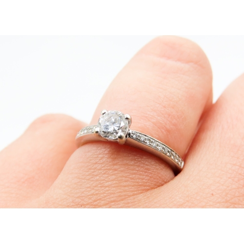 327 - Four Claw Set Diamond Solitaire Ring Mounted in 18 Carat White Gold Further Diamonds Set to Band Rin... 