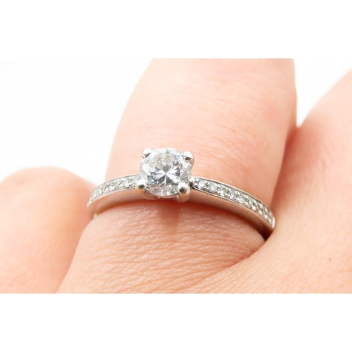 327 - Four Claw Set Diamond Solitaire Ring Mounted in 18 Carat White Gold Further Diamonds Set to Band Rin... 