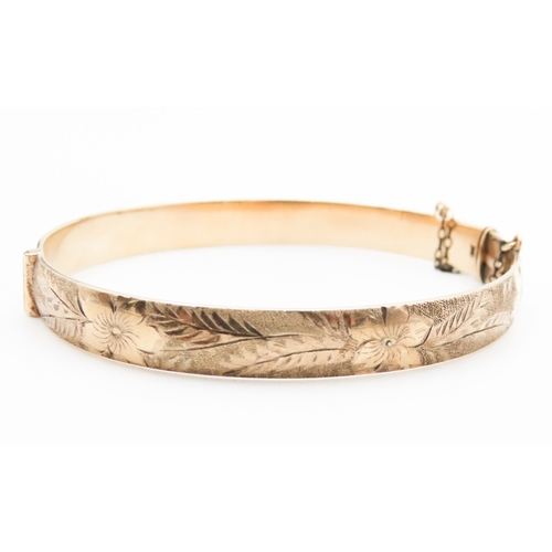 329 - 9 Carat Yellow Gold Bronze Core Bangle Bracelet Incised Floral Detailing Inner Width 6.6cm