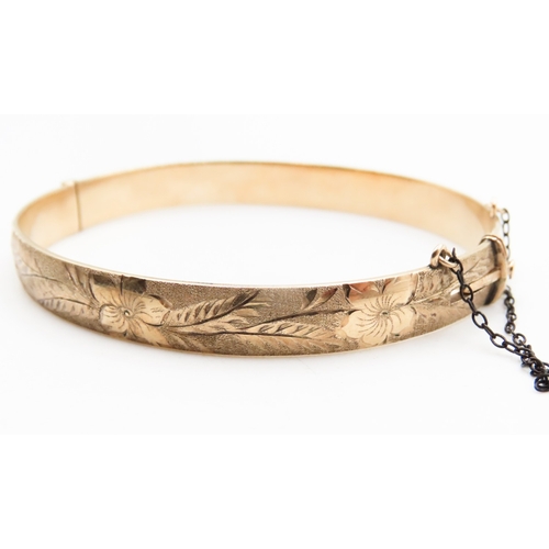 329 - 9 Carat Yellow Gold Bronze Core Bangle Bracelet Incised Floral Detailing Inner Width 6.6cm