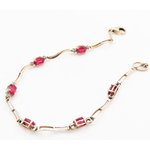 342 - Ruby and Diamond Set Ladies Wave Link Bracelet Mounted in 9 Carat Yellow Gold 19.5cm Long