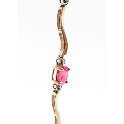 342 - Ruby and Diamond Set Ladies Wave Link Bracelet Mounted in 9 Carat Yellow Gold 19.5cm Long