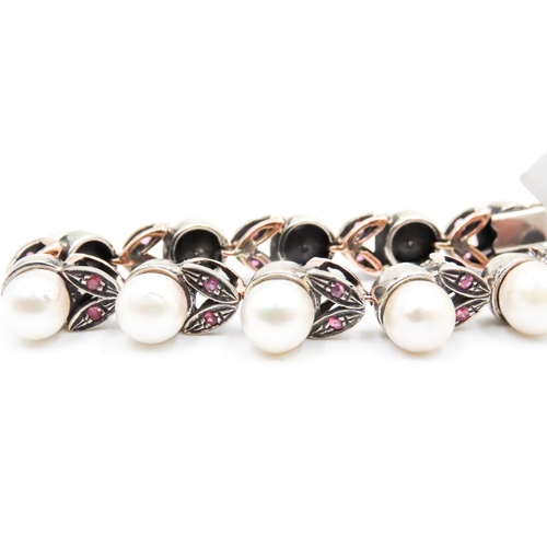 392 - Attractively Detailed Pearl Set Bracelet with Further Ruby Insets Mounted in 9 Carat Yellow Gold Pea... 