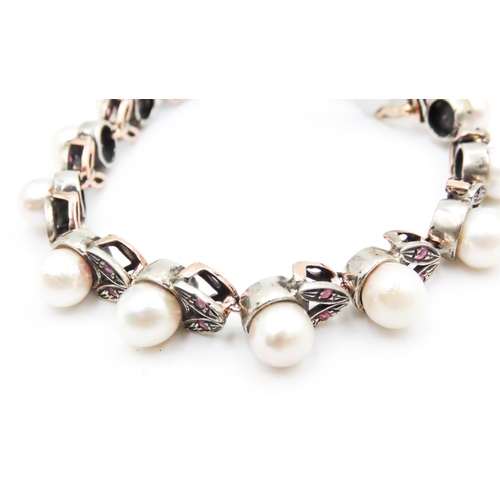 392 - Attractively Detailed Pearl Set Bracelet with Further Ruby Insets Mounted in 9 Carat Yellow Gold Pea... 