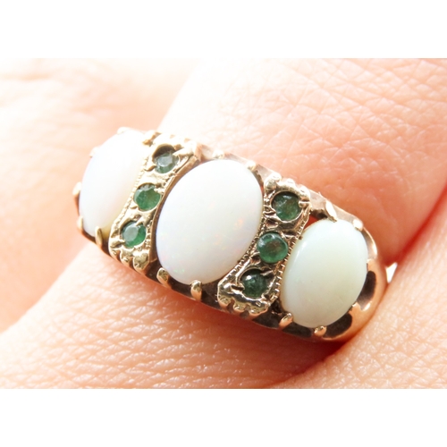 455 - Opal Three Stone Ring Set in 9 Carat Yellow Gold with Further Emerald Inset Ring Size Q