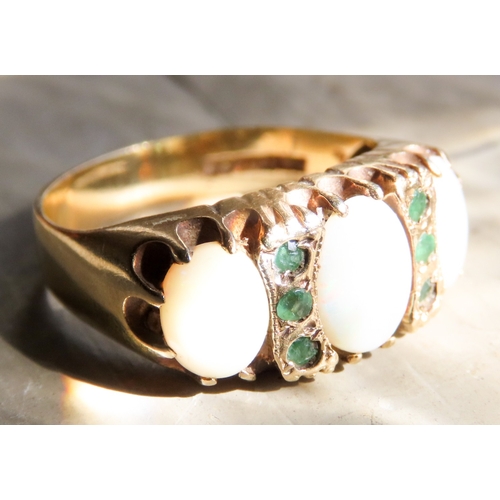 455 - Opal Three Stone Ring Set in 9 Carat Yellow Gold with Further Emerald Inset Ring Size Q