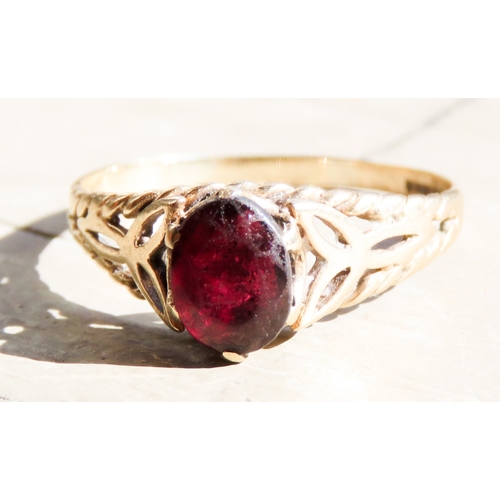 478 - Red Garnet Single Stone Ring Celtic Motif Mounted in 9 Carat Yellow Gold Ring Size U and a Half